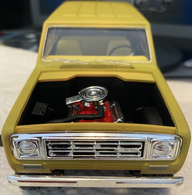 The grille, bumper, and upper radiator hose are all mounted.