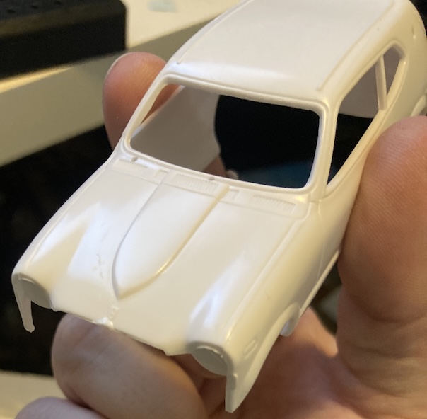 The body is removed from the box, showing a relatively handsome white Honda Z body.