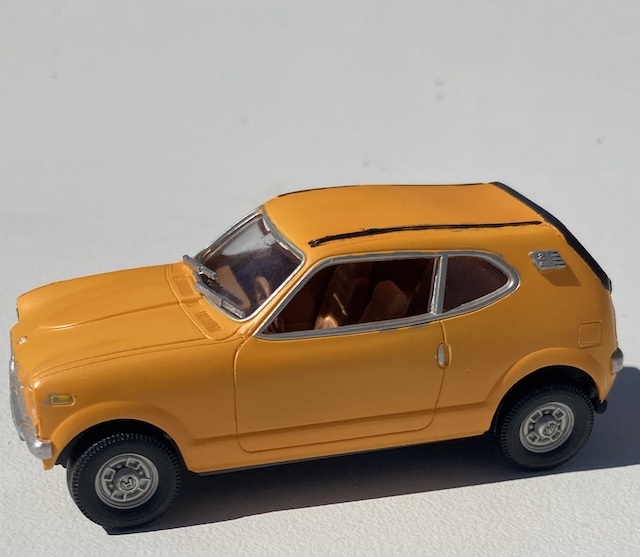 The car is outside, with the passenger side on display.