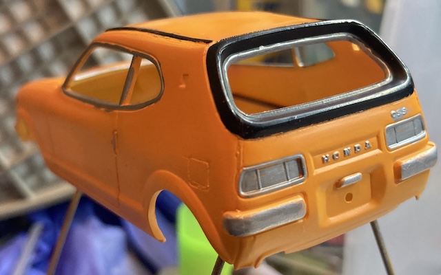 The inner silver trim of the rear window is done. You can see one obvious slip.