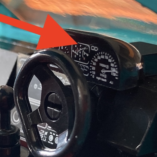 The gauge cluster says "PRND2." There's also a cat hair on it.