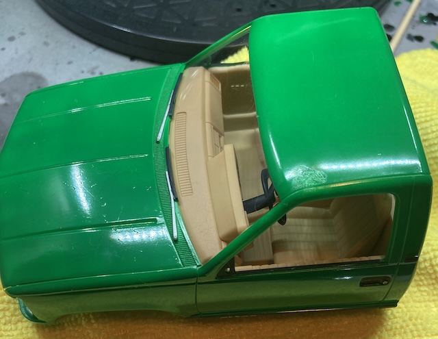 There is a fingerprint of damage right above the driver's door.