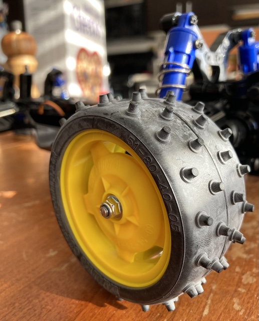 The rear wheel is installed, completing the mechanical part.