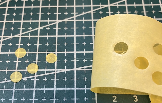 Some 6mm-diameter circles have been cut out of washi tape.