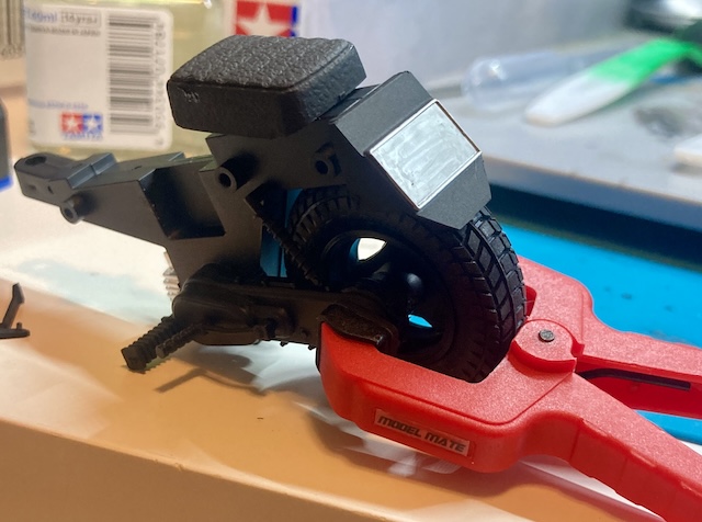 The rear hub is being clamped in so that the glue can cure. You can see a spot of super glue stuck to the seat.
