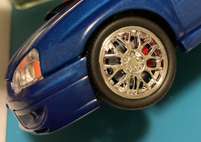 The caliper offers a little dash of colour behind the relatively boring chrome wheel.