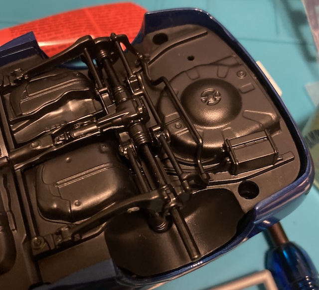 The charcoal canister box is just behind the rear subframe.