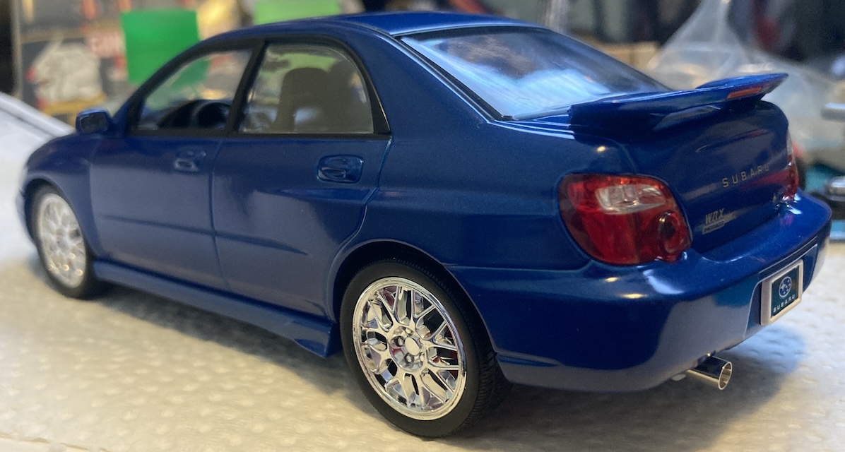 The rear left corner of the car shows the exhaust is now present.