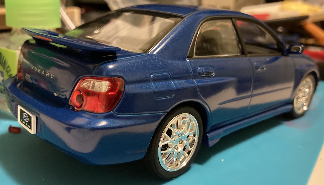 The rear right corner of the car shows the gas cap, and also that I forgot to put the exhaust on for this picture.