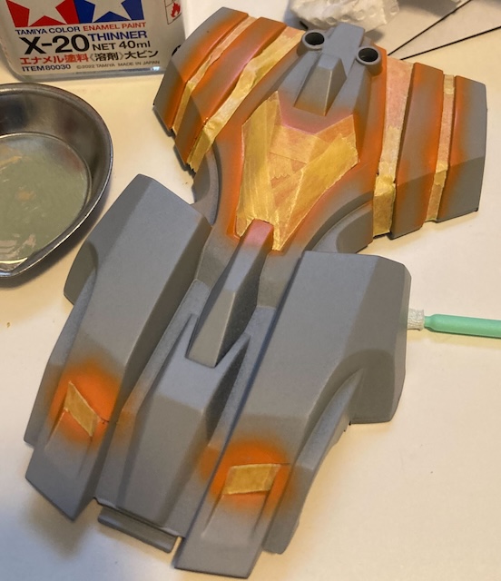 The highlights are covered up by the masking tape to prepare for the colour coat. Some X-20 thinner is in the background, which you absolutely should not use for acrylics.