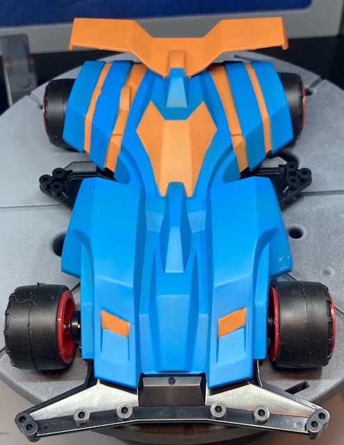 From above, the proportions look more like a classic 80s open-wheel race car. You can still see the damage to the front left corner very clearly.
