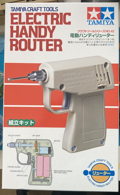 The box, showing all the parts of the Electric Handy Router.
