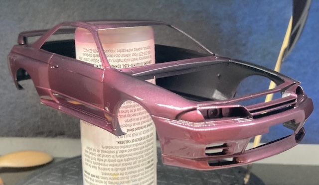 The clear coat has been applied to the model, making it shinier. It hasn't dried yet, so it's really shiny.