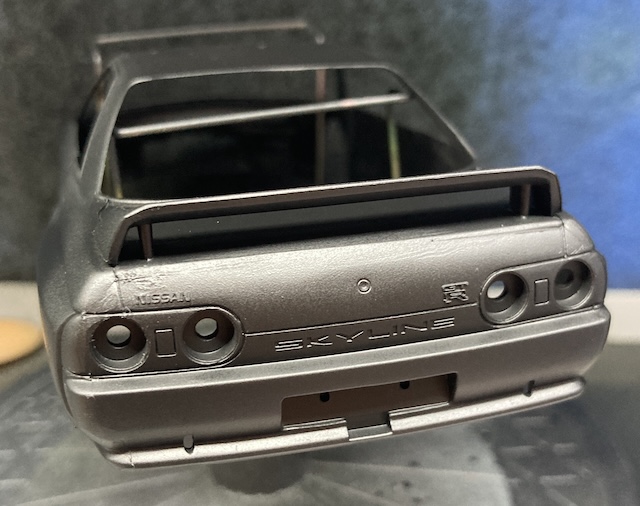 There are several obvious flaws around the tail lights and trunk lid.