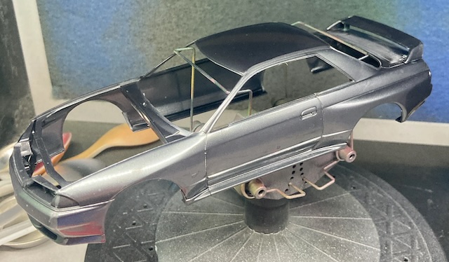 The Skyline's spoiler is attached, and there's lots of sanding dust in every seam.